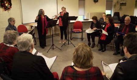 Het IDO-koor in Lelystad: kerstliederen en sprankelende ogen